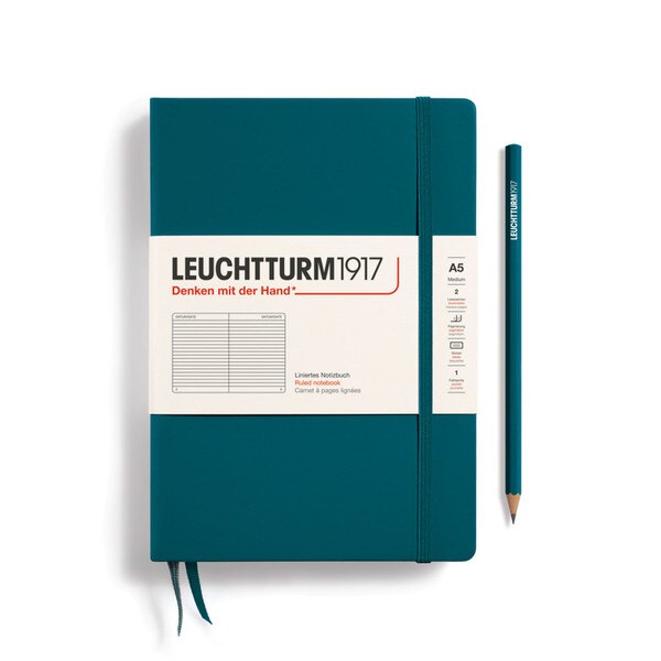 A pacific green colored hardcover notebook.